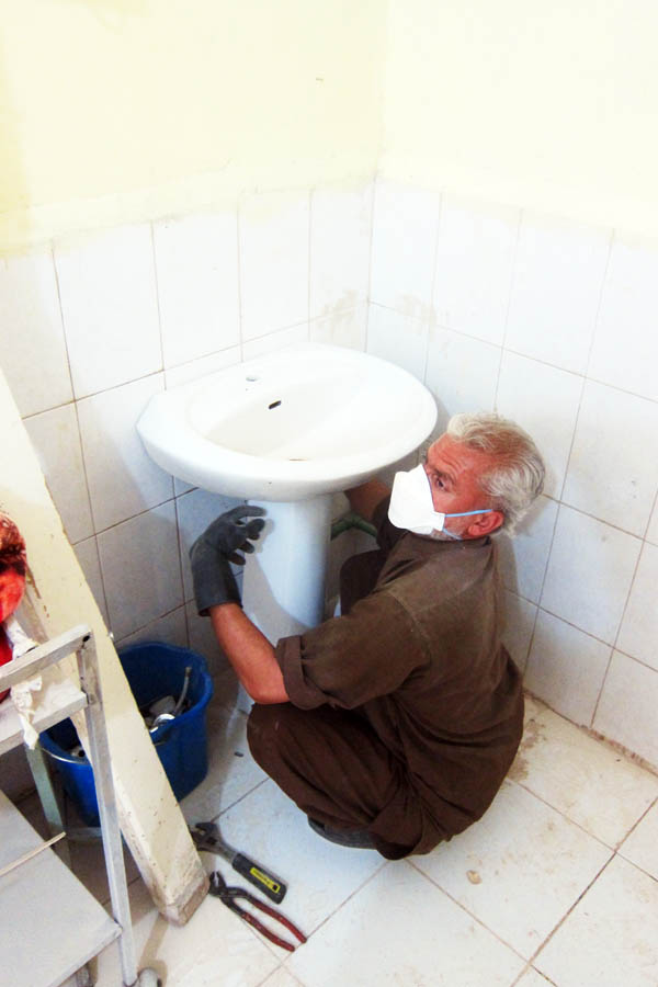 Installing a new handwashing sink in the female burns unit of Bost Provincial Hospital, Lashkar Gah